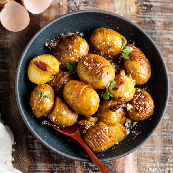 Creamy Hasselback Potato Carbonara - Chasing Cravings